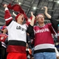 MINSK, BELARUS - MAY 11: Latvian fans cheering on their team against Germany during preliminary round action at the 2014 IIHF Ice Hockey World Championship. (Photo by Andre Ringuette/HHOF-IIHF Images)